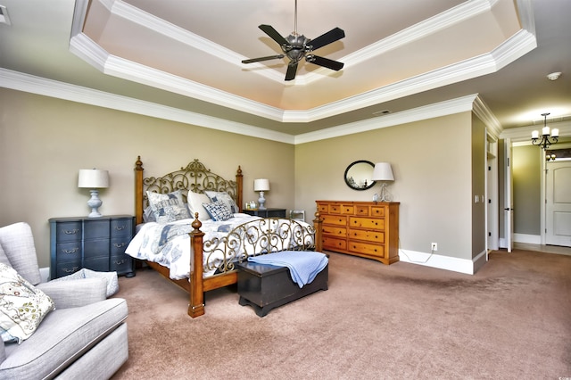 carpeted bedroom featuring visible vents, crown molding, baseboards, ceiling fan with notable chandelier, and a raised ceiling