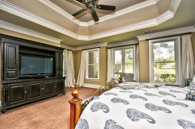 bedroom with visible vents, carpet, ornamental molding, a raised ceiling, and access to outside