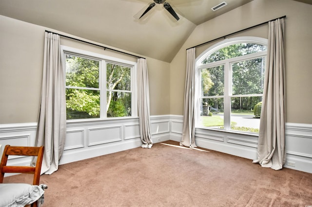 empty room featuring visible vents, a healthy amount of sunlight, and a ceiling fan