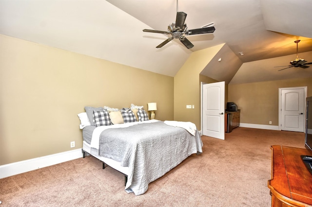 carpeted bedroom with baseboards, a ceiling fan, and vaulted ceiling