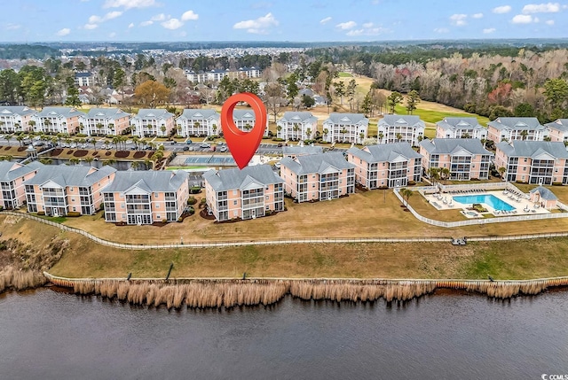 bird's eye view featuring a water view and a residential view