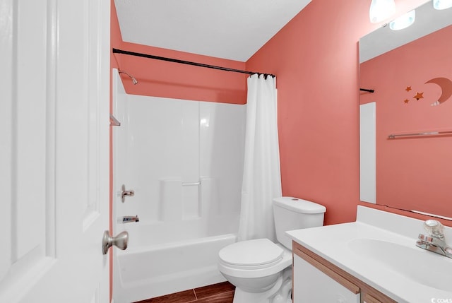 bathroom with vanity, toilet, wood finished floors, and shower / bath combo with shower curtain