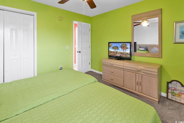 bedroom featuring dark colored carpet, baseboards, and a ceiling fan