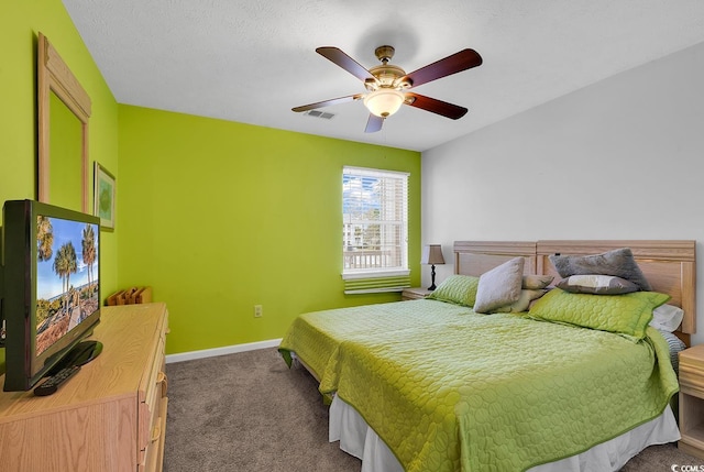 carpeted bedroom with visible vents, baseboards, and ceiling fan