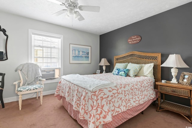 bedroom featuring a textured ceiling, cooling unit, carpet, baseboards, and ceiling fan