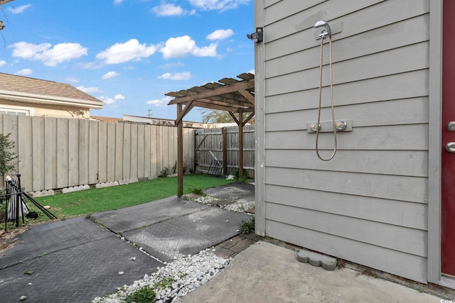 view of patio featuring a fenced backyard and a pergola