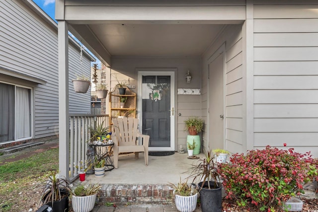 doorway to property with a porch