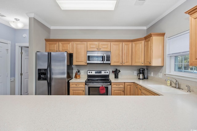 kitchen featuring a sink, light countertops, ornamental molding, and stainless steel appliances