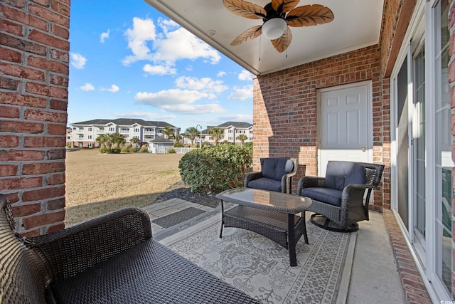 view of patio / terrace with a residential view and ceiling fan