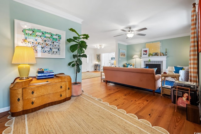 living room featuring crown molding and wood finished floors