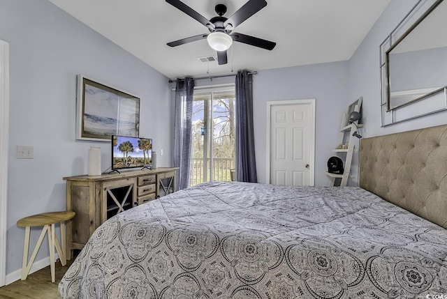 bedroom with wood finished floors, visible vents, baseboards, ceiling fan, and access to outside