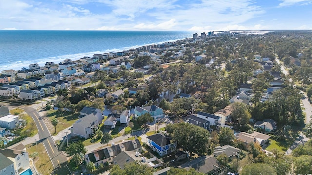 drone / aerial view featuring a residential view and a water view