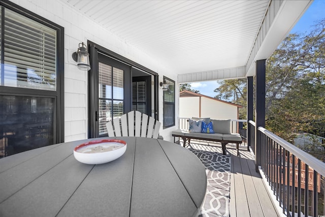 wooden terrace featuring outdoor dining space