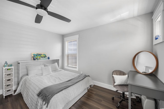 bedroom featuring baseboards, a ceiling fan, and wood finished floors