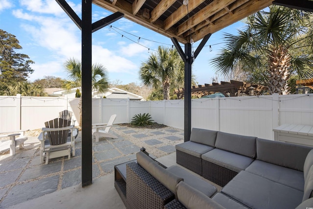 view of patio / terrace with an outdoor living space and a fenced backyard