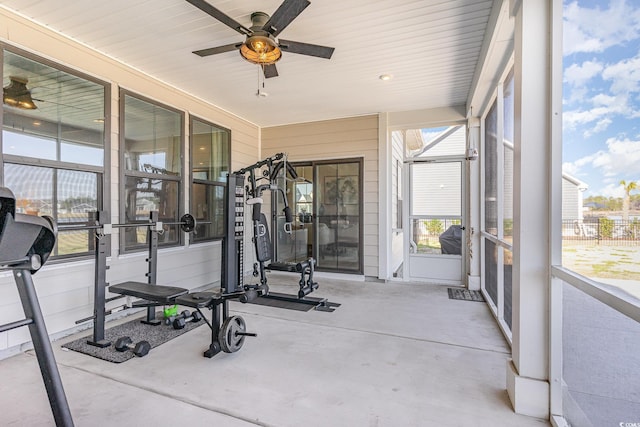 sunroom featuring ceiling fan