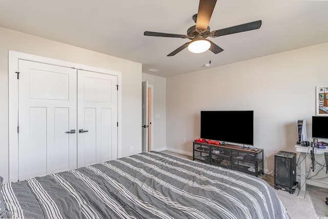 bedroom featuring baseboards, a closet, carpet floors, and ceiling fan