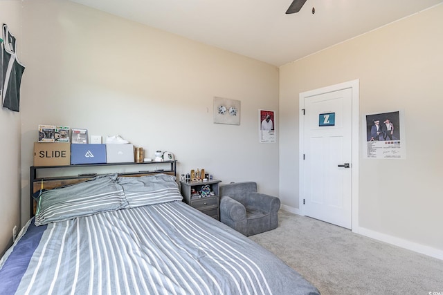 bedroom featuring a ceiling fan, carpet, and baseboards