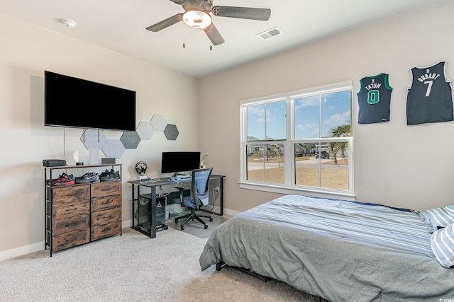 carpeted bedroom featuring baseboards, visible vents, and ceiling fan