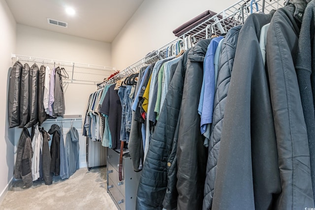 spacious closet featuring visible vents and carpet flooring