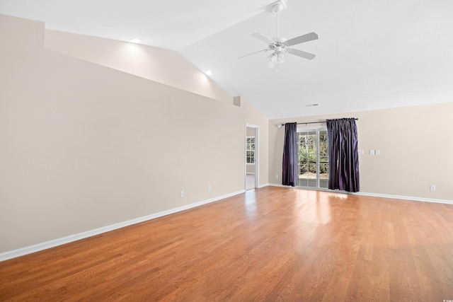 unfurnished living room featuring a ceiling fan, visible vents, baseboards, high vaulted ceiling, and light wood-type flooring