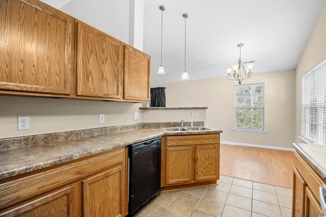 kitchen featuring a chandelier, decorative light fixtures, dishwasher, light tile patterned floors, and a peninsula