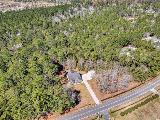 bird's eye view featuring a forest view