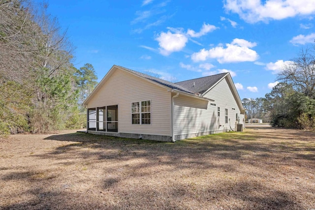 rear view of house with a lawn