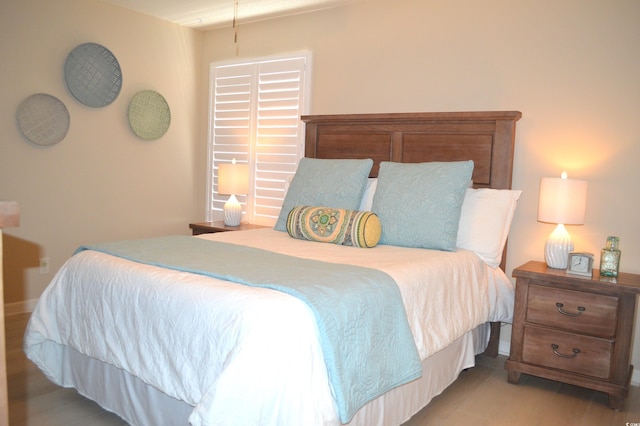 140 Spanish Oak Ct Unit 1, Surfside Beach, SC 29575 - bedroom featuring light wood-type flooring and baseboards