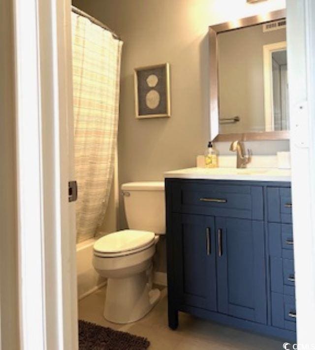 140 Spanish Oak Ct Unit 1, Surfside Beach, SC 29575 - bathroom with toilet, vanity, and curtained shower
