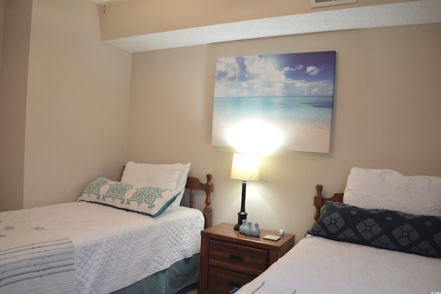 bedroom featuring visible vents