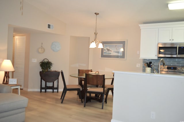 140 Spanish Oak Ct Unit 1, Surfside Beach, SC 29575 - dining space featuring light wood-type flooring and baseboards