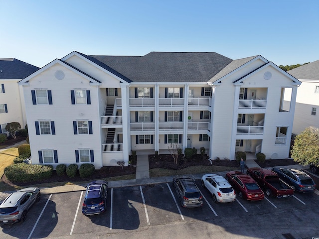 view of property featuring uncovered parking