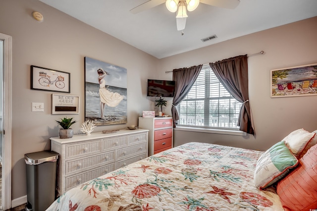 bedroom with visible vents and a ceiling fan