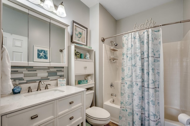 full bathroom with shower / bath combination with curtain, toilet, and vanity