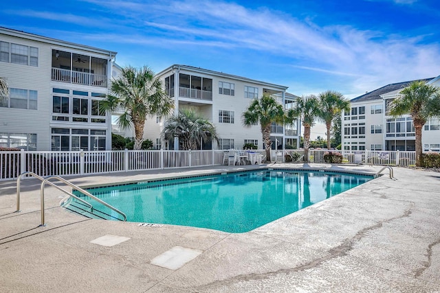 pool featuring a ceiling fan, a patio area, and fence