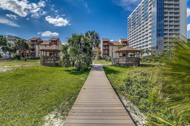 view of property's community featuring a gazebo, a residential view, and a yard