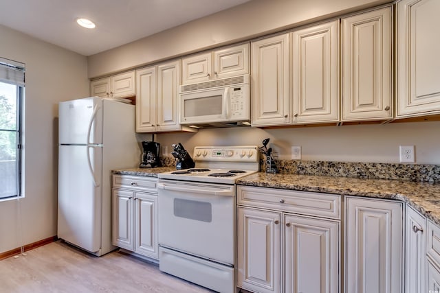 kitchen featuring white appliances, light stone counters, baseboards, light wood finished floors, and recessed lighting