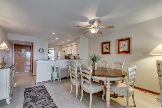 dining room with recessed lighting, baseboards, light wood-style floors, and a ceiling fan