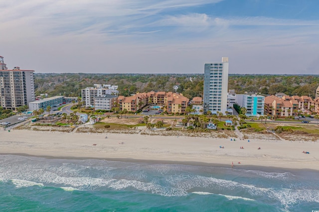 bird's eye view featuring a city view, a beach view, and a water view