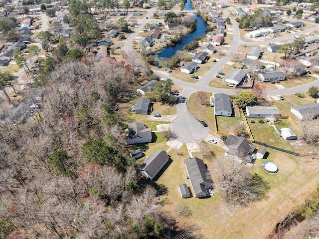 birds eye view of property featuring a residential view and a water view