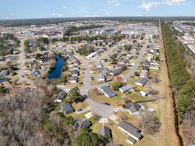 bird's eye view featuring a residential view and a water view