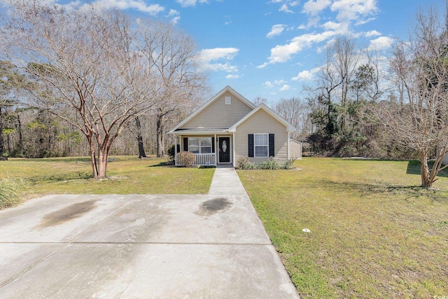 view of front facade featuring a front lawn and covered porch