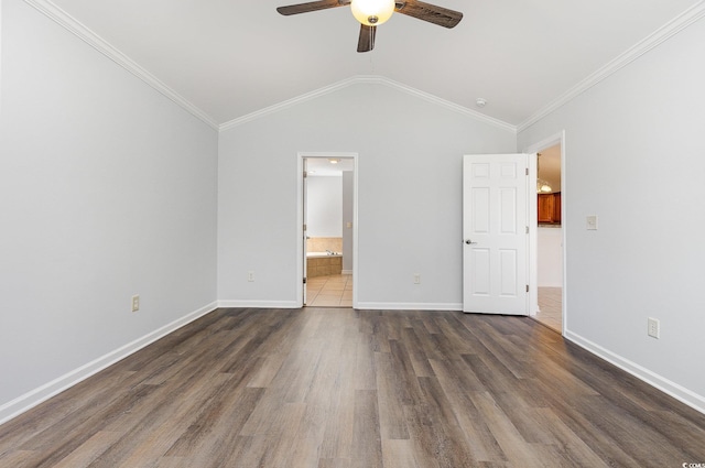 unfurnished bedroom with dark wood-style floors, baseboards, crown molding, and lofted ceiling