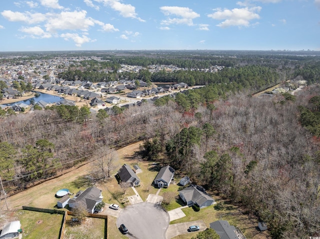 bird's eye view featuring a view of trees and a residential view