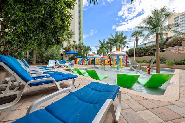 view of patio featuring playground community