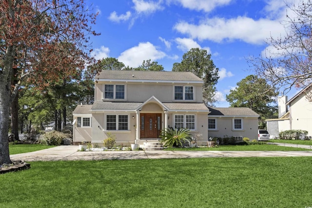 3763 Annandale Dr, Myrtle Beach, SC 29577 - view of front of house featuring stucco siding, concrete driveway, and a front lawn