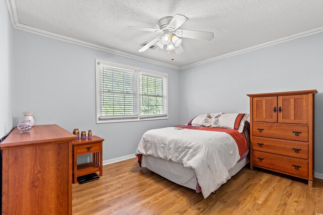3763 Annandale Dr, Myrtle Beach, SC 29577 - bedroom with a textured ceiling, light wood-type flooring, and ornamental molding