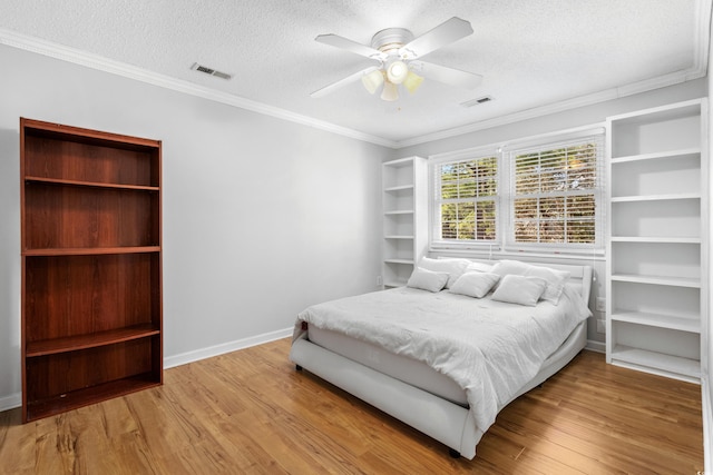 3763 Annandale Dr, Myrtle Beach, SC 29577 - bedroom featuring wood finished floors, visible vents, and a textured ceiling