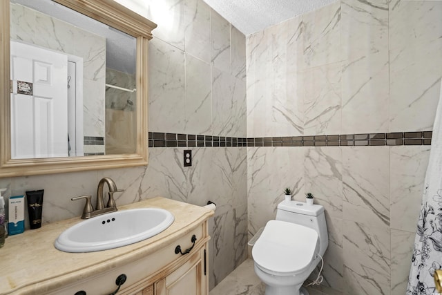 3763 Annandale Dr, Myrtle Beach, SC 29577 - bathroom featuring vanity, toilet, a shower, and a textured ceiling